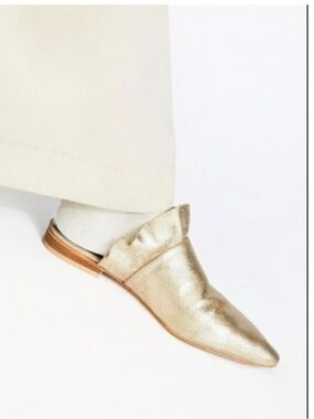 Free People metallic gold pointed-toe mule.